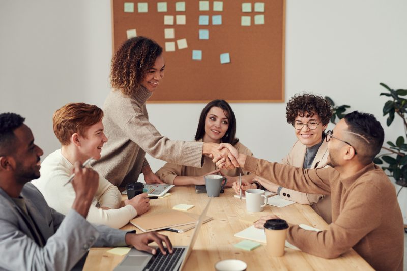 Group of People Sitting and Speaking